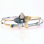 Transcendence Bangle Transcendence Bangle - blossom hand carved from recycled fine silver.