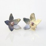 Transcendence Stud Earrings Transcendence Stud Earrings - blossoms hand carved from recycled fine silver.