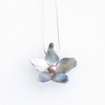 Transcendence Blossom Necklace Transcendence Necklace - blossom hand carved from recycled fine silver.