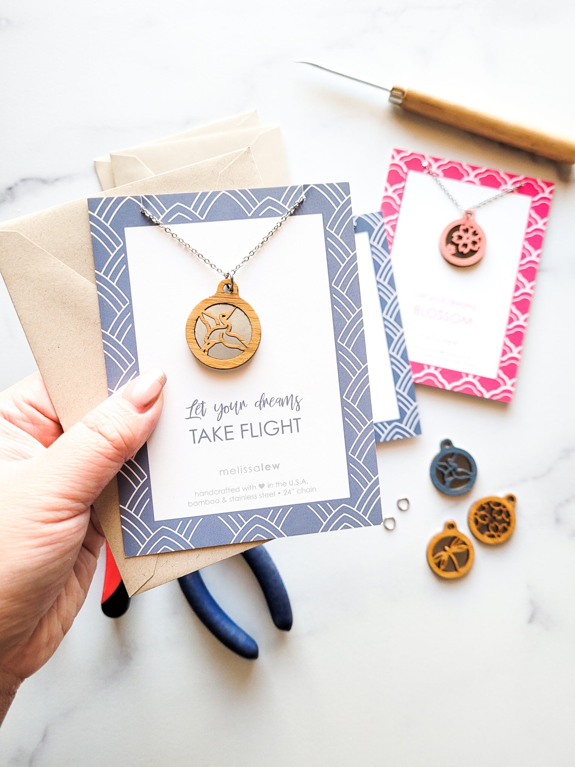 Bamboo necklace with flying crane on card that says, "Let your dreams take flight."