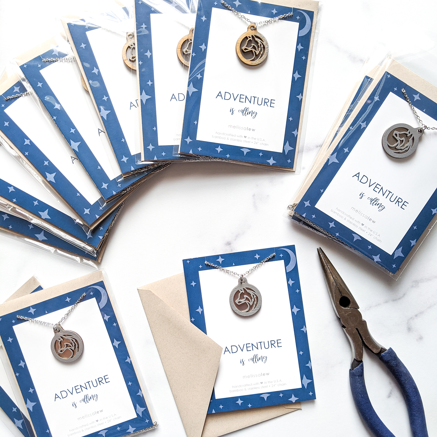 Photos of wolf necklaces being made with the card Adventure is Calling.