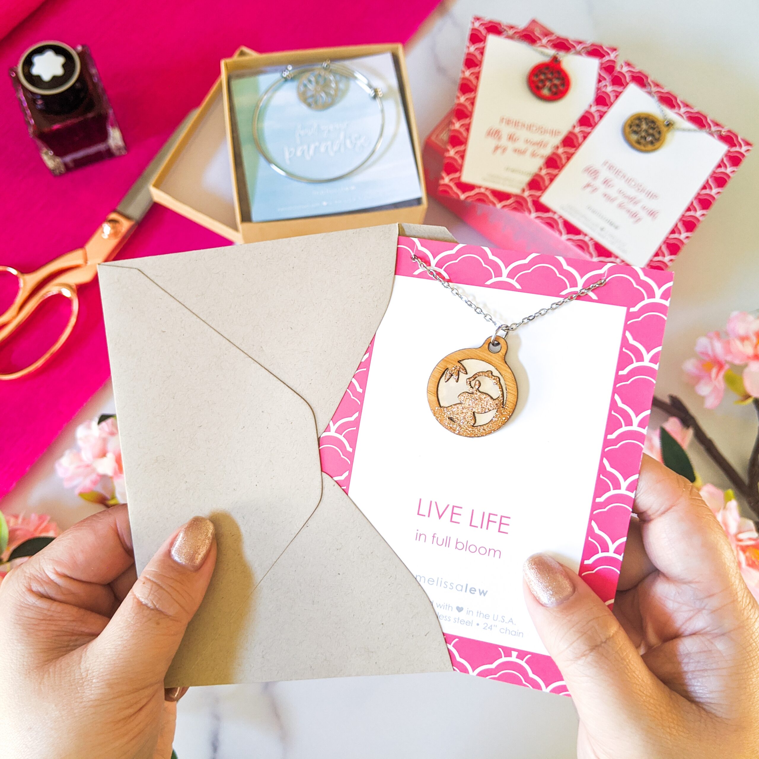 Photo of necklace and card being placed in envelope - gift ready gifts!